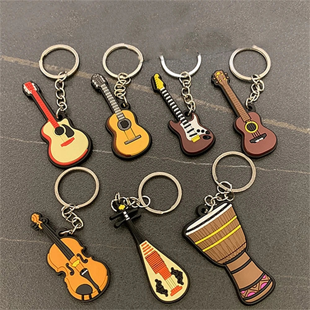 ميدالية مفاتيح لطيفة بأشكال آلات موسيقية من السيليكون: غيتار وساكسفون وبيانو، دلاية للحقيبة ومفاتيح السيارة، هدية لمحبي الموسيقى